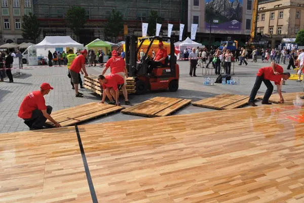 Installation of Action NitroPanel FC portable floor for outdoor charity event, Krakow, Poland