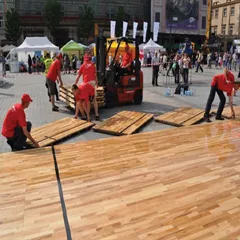 Installation of Action NitroPanel FC portable floor for outdoor charity event, Krakow, Poland